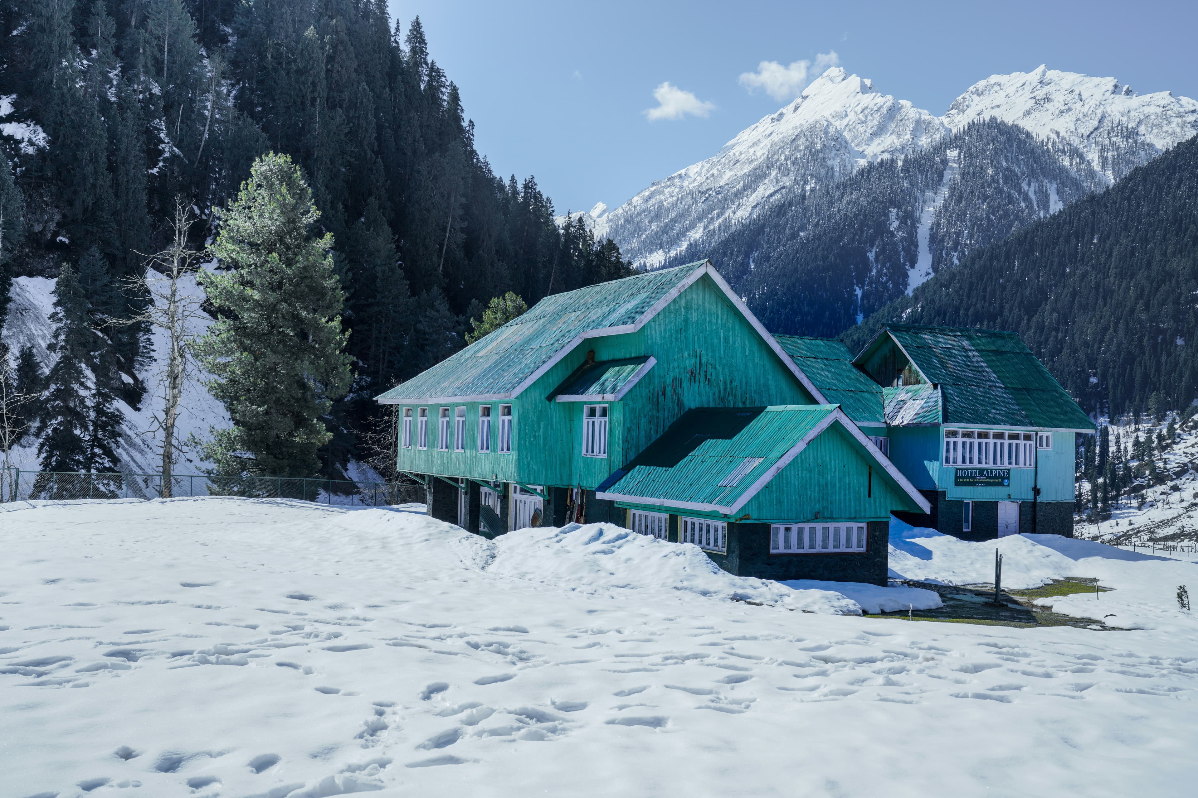 Snow-covered hotel in Pahalgam